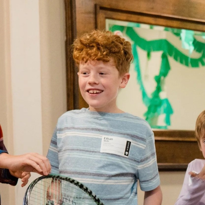 A smiling grade school boy at church